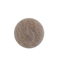 Three-Eighths Inch Round Mini Self-Stick Furniture Felt Pads For Hard Floors, close-up of beige pad for sofa or dresser protection.