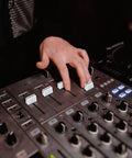 Person using 8 Pack Black Fader Caps For DJ Mixers Premium Slider Knob Replacements For Pioneer DJM Series on a DJ controller