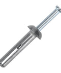 Close-up of one quarter inch by one inch hammer drive anchors with nails masonry fasteners for concrete brick and block zinc alloy coated