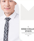 Eighty Piece Pack Of Invisible Adhesive Shirt Collar Stays on a man wearing a white shirt and a black tie.