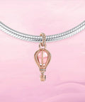 Pink Hot Air Balloon Charm in rose gold plating for bracelets with cubic zirconia and pink crystal accents on a necklace.