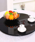 Rotating Lazy Susan Turntable For Kitchen And Dining Table Black Tempered Glass With Durable Aluminum Base holding fruit and cups