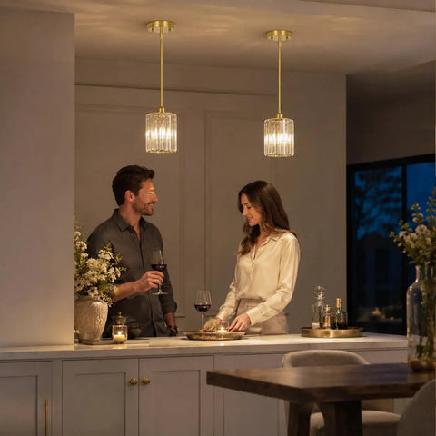 Brushed Gold Crystal Pendant Light With Adjustable Rods And Sloped Ceiling Mount No Sweat Install Super Smooth Hang Straight Up Elegant Lamp For Kitchen Island Dining Space E26 Base illuminating a couple in a warm dining setting.