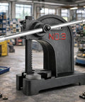 Heavy Duty Arbor Press Featuring 3 Ton Capacity And 12 Inch Stroke For Precision Leather Stamping Metal Forming And Workshop Assembly Crafted From Tough Cast Iron standing in workshop.