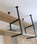 Heavy Duty Floating Shelf Bracket Ceiling Mount Metal Pipe Shelf Wrought Iron Storage Rack For Kitchen Bar Dining Room Built Different Holds 110 Lbs Easy With Screws Included showing black wrought iron brackets with wooden shelves.