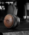 Close-up of 58mm Espresso Distributor With Adjustable Depth For All 58mm Portafilters Stainless Steel And Walnut Build.
