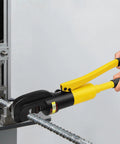 Heavy Duty Hydraulic Rebar Cutter 13 Ton Cuts Up To 22mm Steel Rods in use, cutting reinforced steel rods with yellow handles.