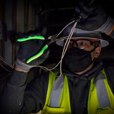 Worker using Glow In The Dark 8 Inch Long Nose Pliers With Hi Vis Grips For Reach And Leverage Heavy Duty Needle Nose Pliers For Tight Spaces.
