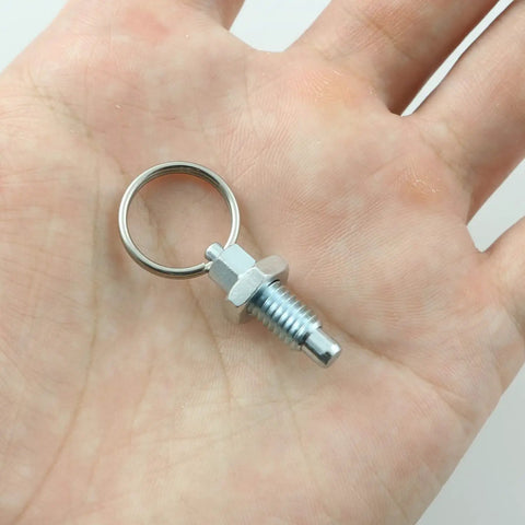 Heavy Duty M6 Stainless Steel Spring Plungers With Pull Ring 4 Pack Non Locking Telescopic Thumb Pin held in hand.