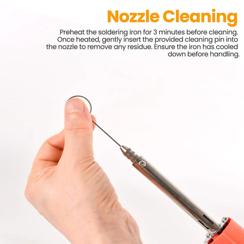 Person cleaning the nozzle of the Dual Use 30W Electric Desoldering Gun Solder Sucker and Iron With Multiple Nozzles