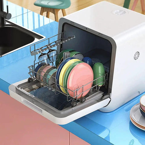 Compact Countertop Dishwasher Packs Six Place Settings And Five Wash Cycles To Get Dishes Done Quick Featuring Steam Baby Sterilizer Auto Air Dry And Smart LED Interface Ideal For Tight Apartments with plates and glasses loaded.