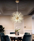 Gold 9 Light Crystal Ceiling Chandelier Pendant Lighting Fixture for Dining Room with modern sparkling crystals above table.