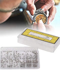 Stainless Steel Watch Case Back Screw Set With 12 Precise Sizes For Pro Grade Watch Repair kit next to a watchmaker's hand repairing a watch.