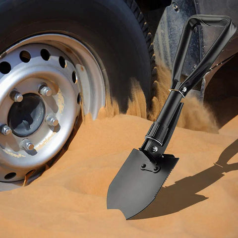 Grab And Go Folding Shovel For Car And Camping 18.5 Inch Collapsible Shovel With Pickaxe in sand near car wheel