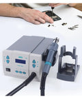 Powerful 1000W Soldering Hot Air Rework Station With Digital Display And Adjustable Airflow in use for mobile phone PCB repair.