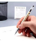 Hand using Gel Ink Pen Extra Fine Point 0.35mm Ballpoint Black for office, school, and home use, smooth writing on paper