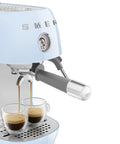 Totally Iconic Retro Espresso Maker With Cold Brew Feature, Packin 15 Bars Of Pressure, Smooth Operation Steam Wand, Exact Temp Control, Huge 47 Oz Tank In Chill Pastel Blue brewing espresso into two glasses.