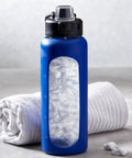 Countertop Nugget Ice Maker With Dispenser Churning Out Chewable Flake Ice On The Fly With Up To Three Hundred Fifty Pounds Daily Production Featuring Hassle Free Cleaning Panels For Your Bar Or Kitchen, blue ice maker with ice inside.