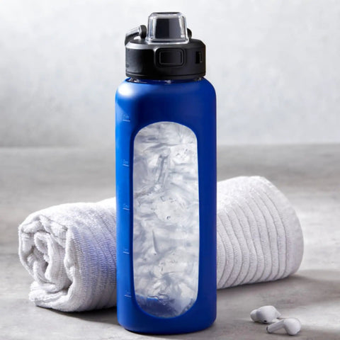 Countertop Nugget Ice Maker With Dispenser Churning Out Chewable Flake Ice On The Fly With Up To Three Hundred Fifty Pounds Daily Production Featuring Hassle Free Cleaning Panels For Your Bar Or Kitchen, blue ice maker with ice inside.