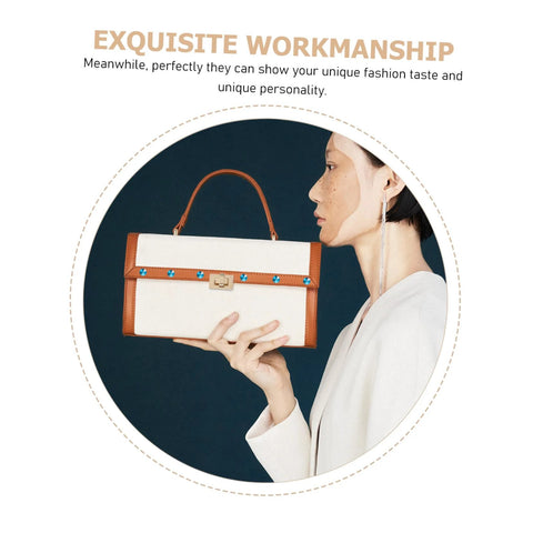 Cream canvas handbag with brown leather trim and blue stud rivets, held by a model.