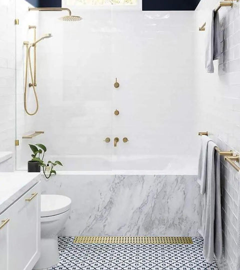 Bathroom with 24 Inch Linear Shower Drain With Removable Cover Grid And Hair Catcher Brushed Gold Stainless Steel Trench Floor Drain.