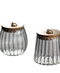 Level Up Your Kitchen With This Tough Clear Glass Storage Jar Boasting A Tight Airtight Wooden Lid Sealed Cap For Grains Coffee Beans Candy And Spices To Keep Everything Fresh On Hand, showcasing two ribbed glass jars with wooden lids.