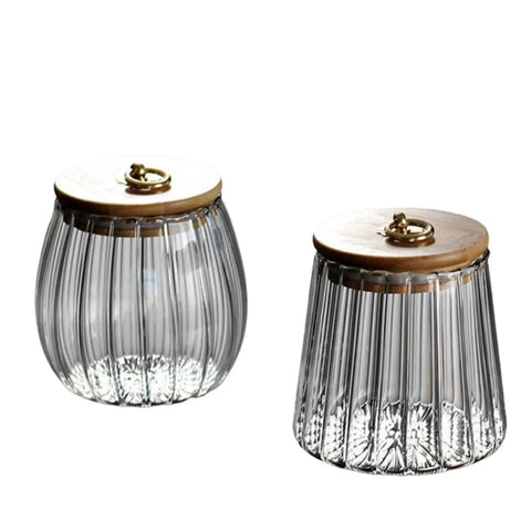Level Up Your Kitchen With This Tough Clear Glass Storage Jar Boasting A Tight Airtight Wooden Lid Sealed Cap For Grains Coffee Beans Candy And Spices To Keep Everything Fresh On Hand, showcasing two ribbed glass jars with wooden lids.