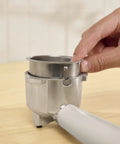20 Bar Slim Espresso Maker With 1300 Watt Pump And 360 Degree Steam Wand For Silky Microfoam, close-up of portafilter with hand adjusting.