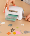 Hand operating Portable Manual Die Cutting And Embossing Machine for DIY crafting with paper dies on table