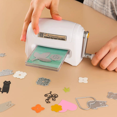 Hand operating Portable Manual Die Cutting And Embossing Machine for DIY crafting with paper dies on table