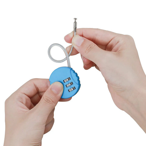 Hands holding blue 3-digit combination lock with cable from 2 Pack 3 Digit Outdoor Waterproof Padlocks For Lockers Luggage Gym School Fence Toolbox Gate Case And More Heavy Duty Durable Combination Locks For Secure Storage.