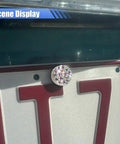 Close-up of Fly Bling Rhinestone License Plate Screw Kit with sparkly bolts mounted on a vehicle license plate.