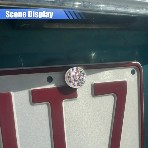 Close-up of Fly Bling Rhinestone License Plate Screw Kit with sparkly bolts mounted on a vehicle license plate.