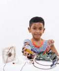 TEHAUX 12V mini push-pull solenoid electromagnet on a circuit board; child assembling electronics with tools