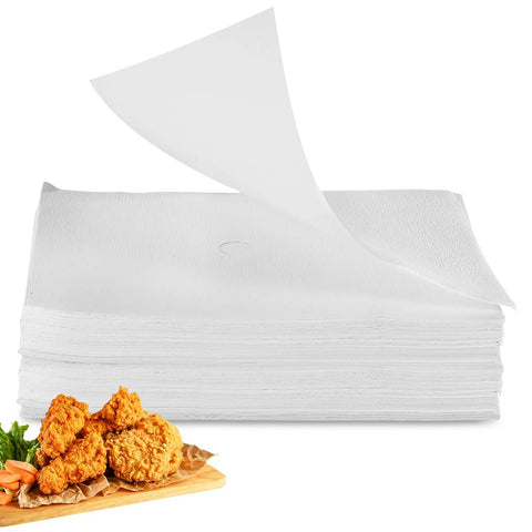 Essential Envelope Fryer Filter Paper For 55L Commercial Deep Fryers 13.6 By 17.3 Inches stacked beside fried chicken.