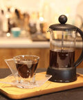 French Press Coffee And Tea Maker 12 Oz with borosilicate glass and four level filtration system on a wooden tray