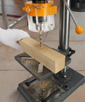 Variable Speed Benchtop Drill Press With Five Eighth Inch Chuck, 170mm Work Table And 50mm Spindle Travel drilling wood block