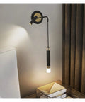 Upgrade Your Hangout With These Top Tier Wall Sconces And Hanging Wire Lamp Pair Offering Glare Free Led Lighting For Chill Living Room Or Bedroom Setup In Warm White Matte Acrylic Shading. Black wall sconce with hanging bulb, warm LED glow.