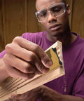 Man using Clutch Ergonomic Contour Sanding Grip Set with rubber palm pad on wood for smooth finish
