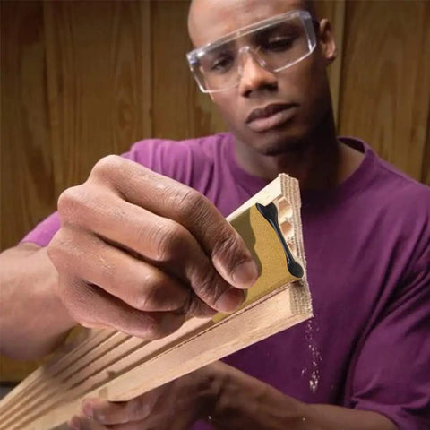 Man using Clutch Ergonomic Contour Sanding Grip Set with rubber palm pad on wood for smooth finish