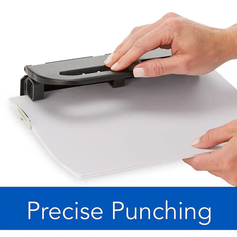 Heavy Duty Two To Seven Hole Punch With Semi Adjustable Heads Easy Touch Soft Grip Handle Twenty Four Sheet Capacity Durable Metal Construction Office Workhorse Punch For High Volume Black in use for precise punching of documents.