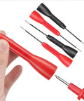 Hand holding red probe, black and red 4 Pack 2mm Extended Needle Test Probes 600V 10A Insulation Piercing Tips shown.