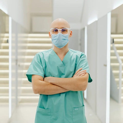 Healthcare professional wearing 4 Pack Safety Glasses Anti Fog Clear Goggles With Side Shields For Men Women Nurses And Adults