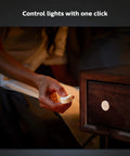 Hand using Wireless Smart Light Switch Button Battery Powered And Portable White Remote For Easy No Wire Setup