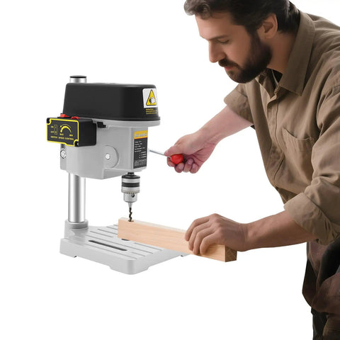 Portable Desktop Drill Press For Wood And Metal, 340W Electric Mini Bench Drill in use with a wood piece.