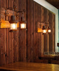 Industrial Farmhouse Wall Sconce Lighting Fixture With Wooden Base And Two Lantern Lights For Bars And Restaurants E26 Bulbs Not Included in rustic dining area