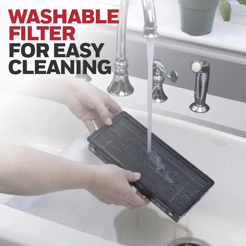Hands washing a filter from QuietClean Tower Air Purifier For Medium Rooms Up To 170 Sq Ft With Permanent Washable Filters