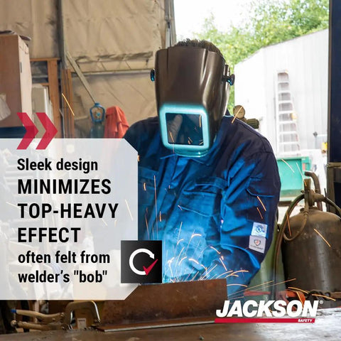 Welder wearing HLX 100 Welding Hood Lightweight Fixed Front Helmet Shade 10 ANSI Z87.1 Hydraflex Shell, sparks flying in workshop.