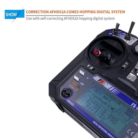 Close-up of Flysky FS-i6 6CH 2.4GHz AFHDS 2A RC Transmitter with display and controls.