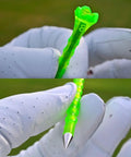 Close-up of Forever Tee Premium Metal Unbreakable Golf Tees 2 Pack With Extended Metal Tip held by gloved hand